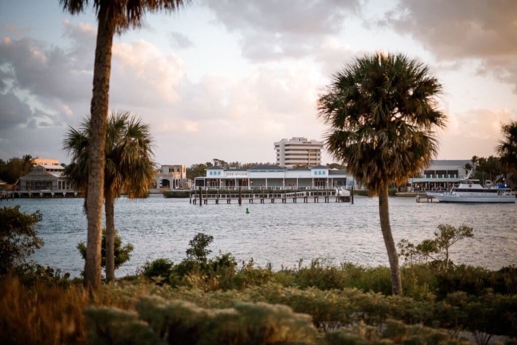 Scenic waterfront view of Pelican Club Jupiter venue taken from across the water with calm Intracoastal Waterway