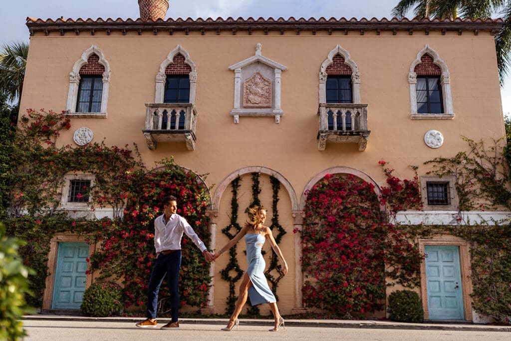 Couple walking hand-in-hand on Worth Avenue in Palm Beach