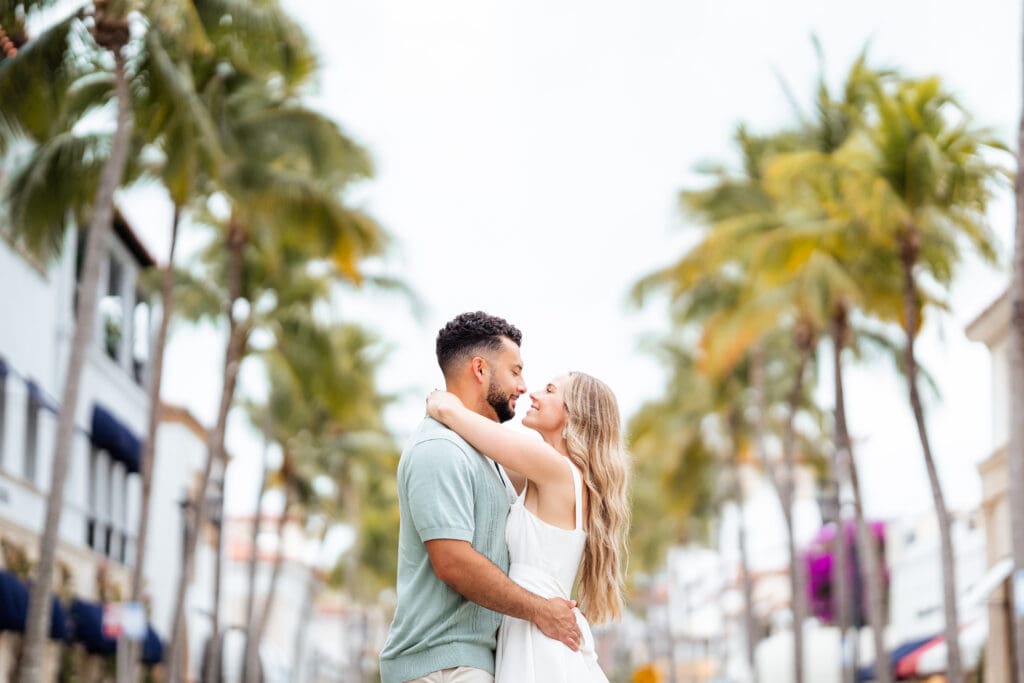 Couple under Palm Trees on Worth Ave