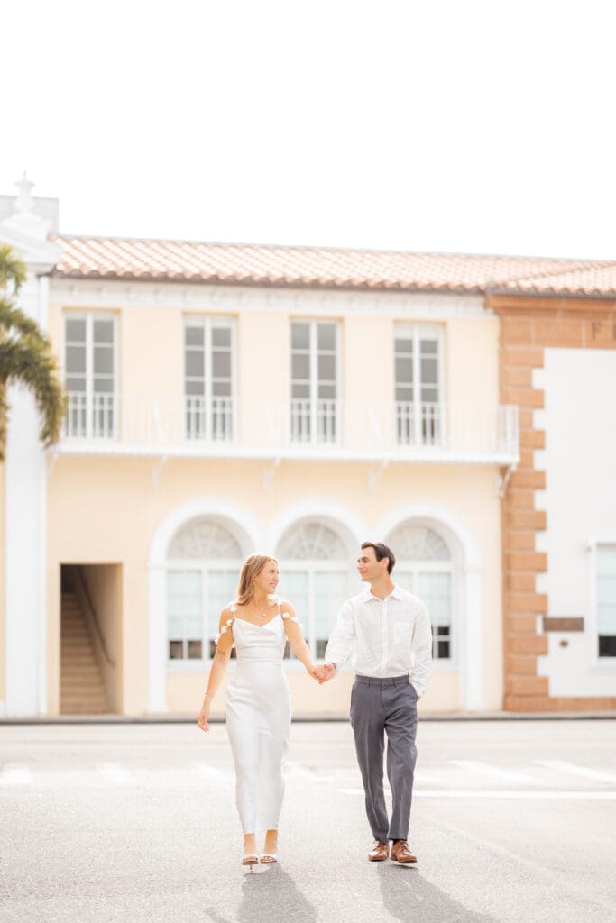 Couple walking on South County Road in Palm Beach