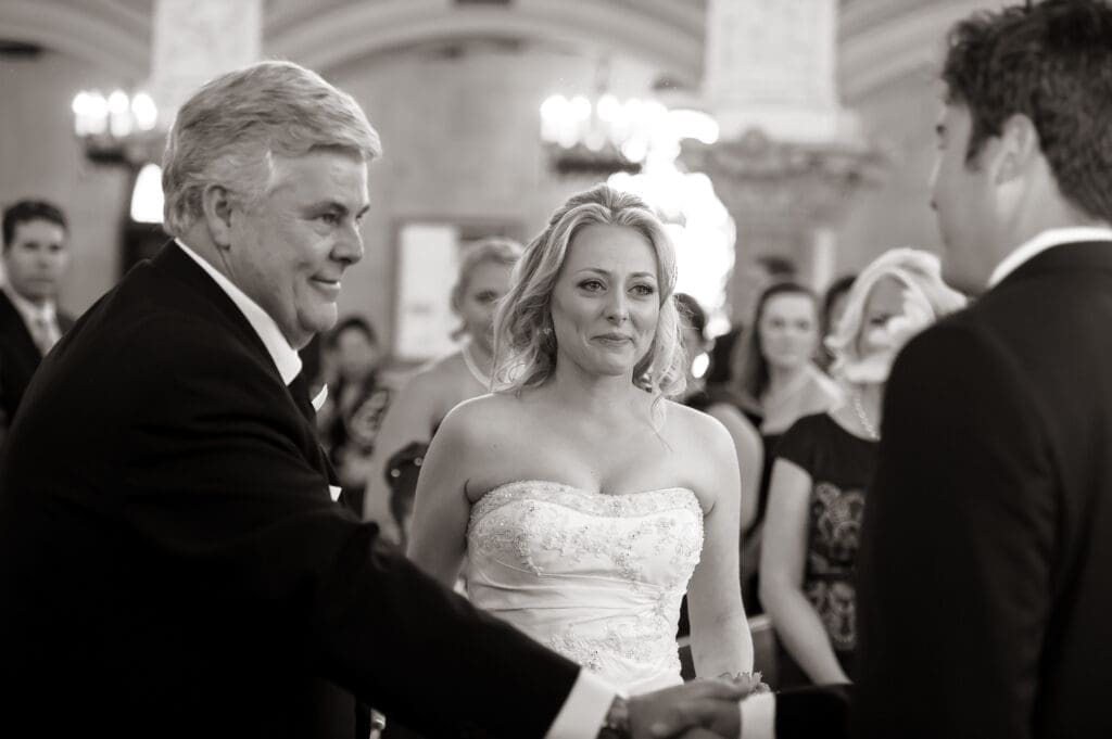 bride seeing groom as walking down the aisle
